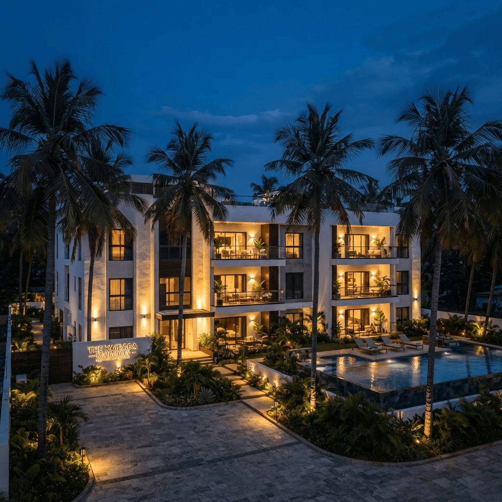 Diamond Edge Apartments building at dusk, framed by palm trees in Kotu